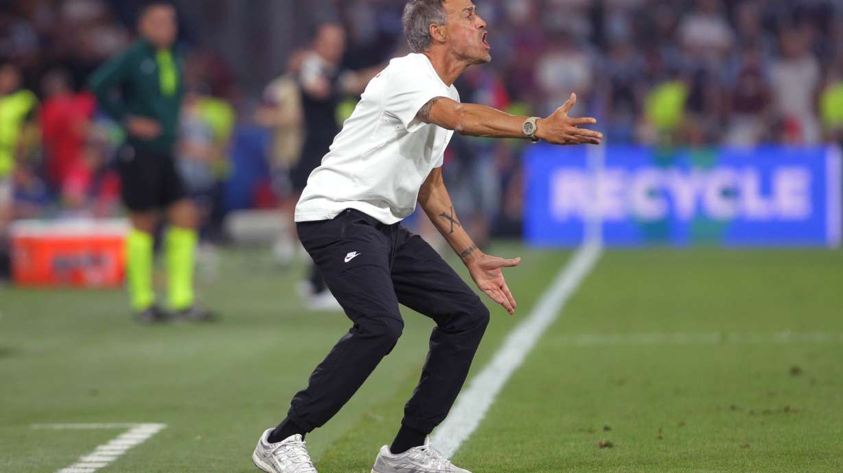 PSG's head coach Luis Enrique instructs his players during the UEFA Super Cup soccer match between Paris Saint-Germain and Aston Villa in Salzburg, Austria, Wednesday, Aug. 12, 2026.