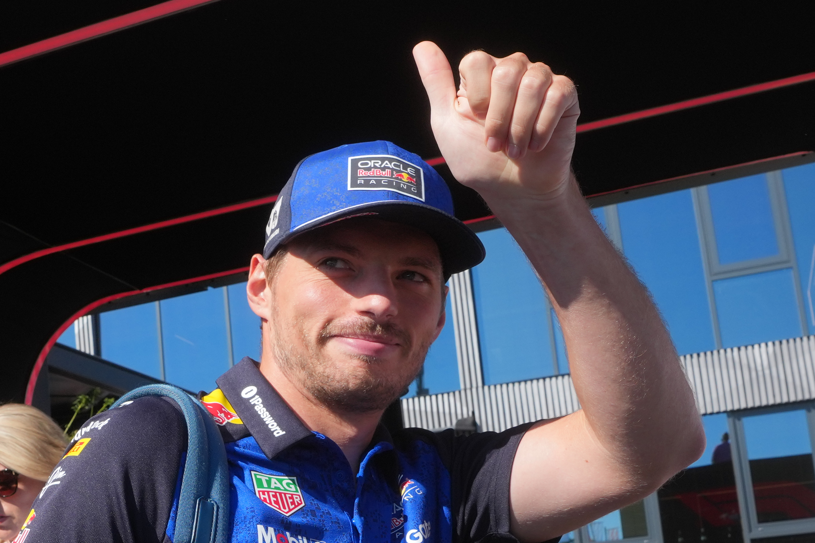 Red Bull driver Max Verstappen of the Netherlands gives a thumbs up to fans as he arrives in the paddock prior to the first free practice ahead of Sunday's Italy Grand Prix, at the Monza racetrack, Italy, Friday, Sept. 4, 2026. 