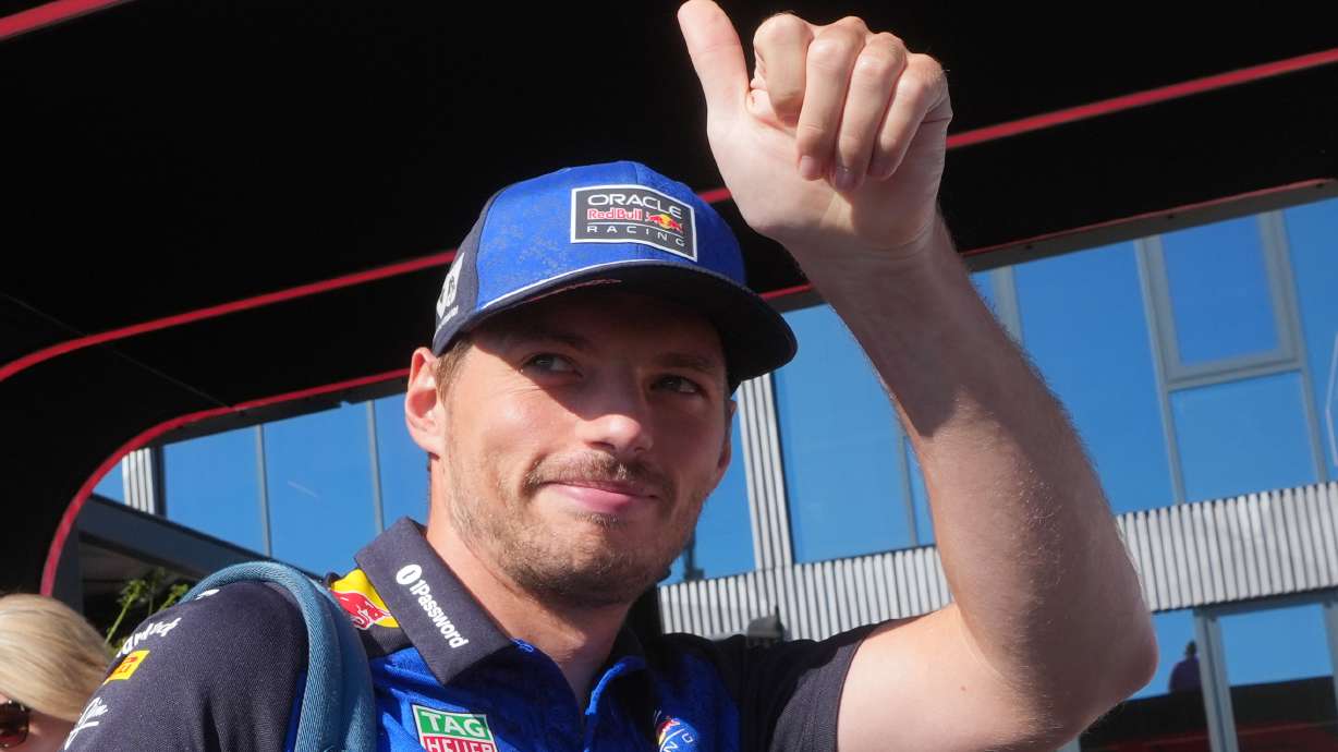 Red Bull driver Max Verstappen of the Netherlands gives a thumbs up to fans as he arrives in the paddock prior to the first free practice ahead of Sunday's Italy Grand Prix, at the Monza racetrack, Italy, Friday, Sept. 4, 2026.