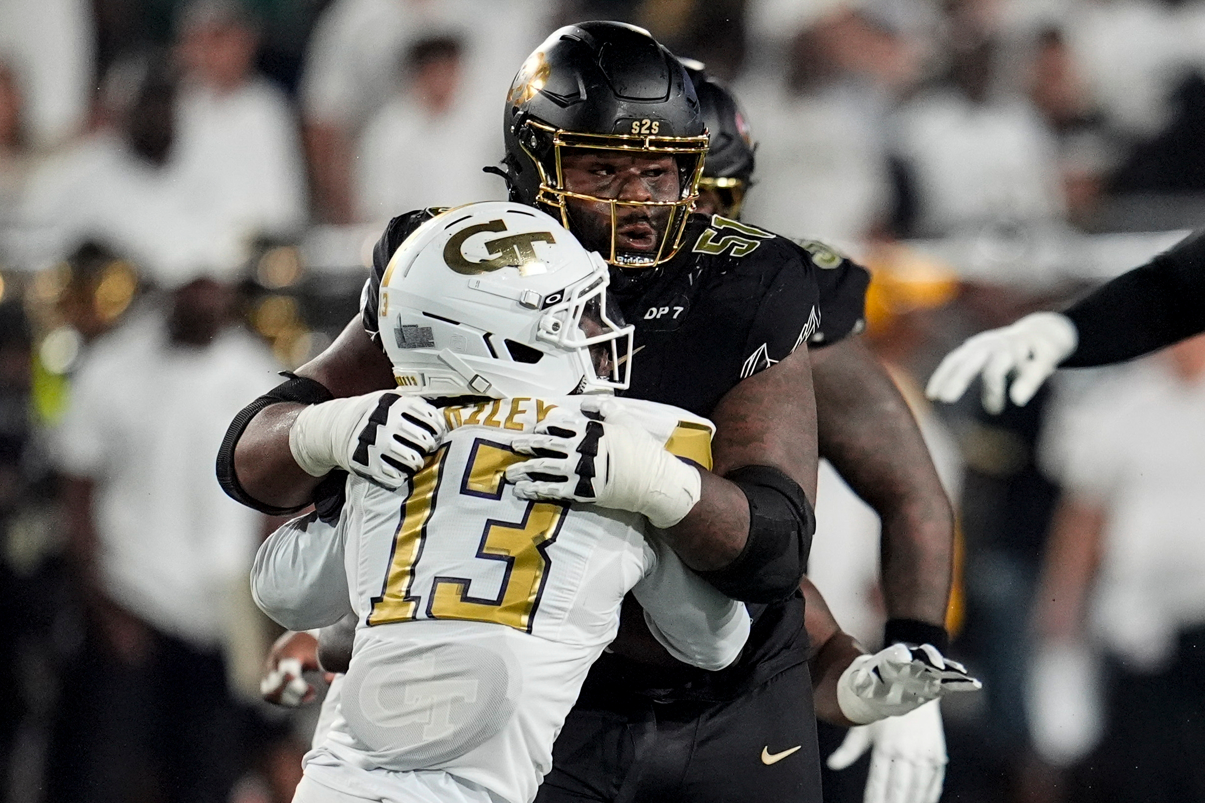 Colorado offensive lineman Chauncey Gooden (51) blocks Georgia Tech safety Savion Riley (13) during the first half of an NCAA college football game, Thursday, Sept. 3, 2026, in Atlanta. 