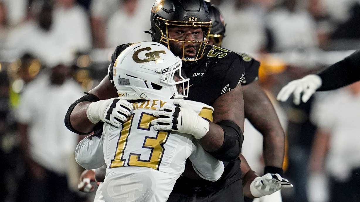 Colorado offensive lineman Chauncey Gooden (51) blocks Georgia Tech safety Savion Riley (13) during the first half of an NCAA college football game, Thursday, Sept. 3, 2026, in Atlanta.