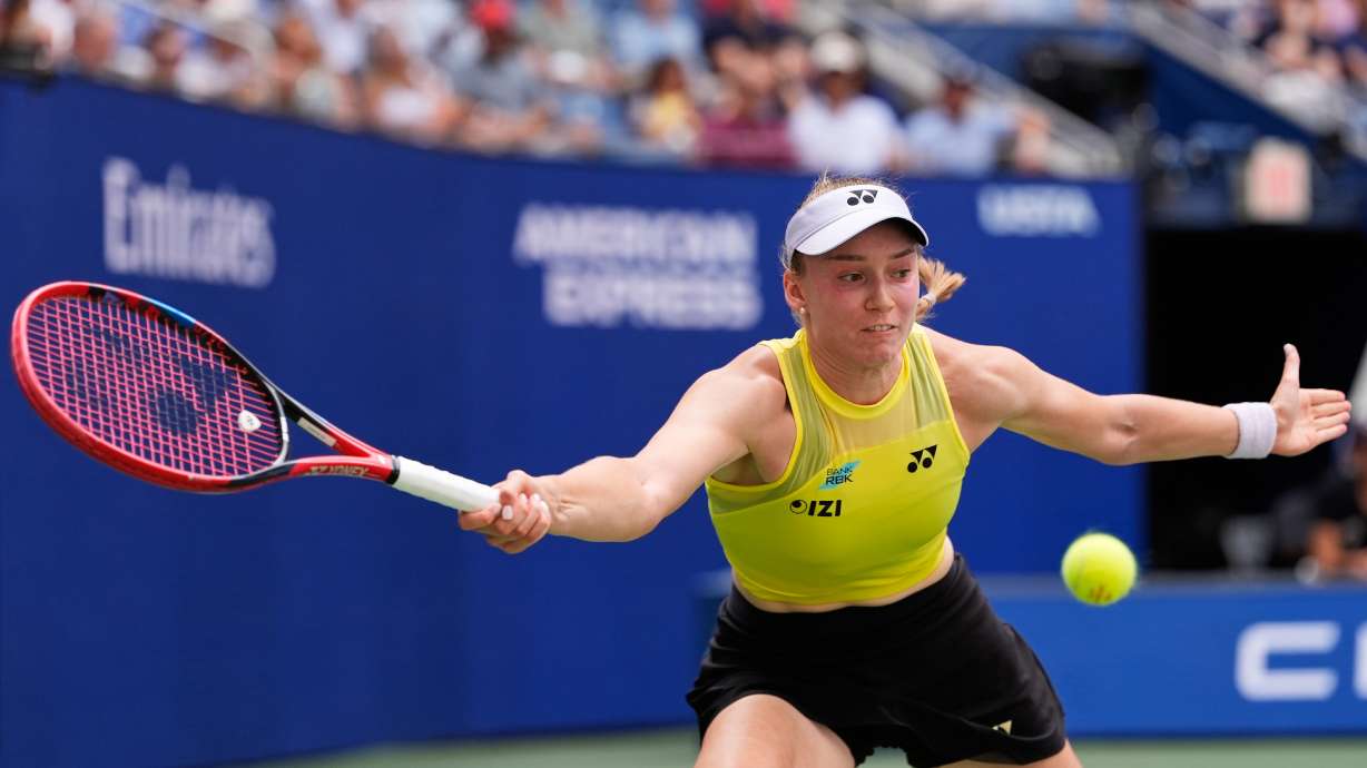 Qinwen Zheng, of China, returns the ball to Elena Rybakina, of Kazakhstan, during the quarterfinal round of the U.S. Open tennis championships, Wednesday, Sept. 9, 2026, in New York.