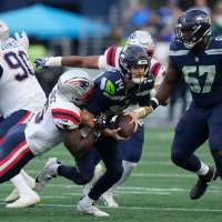 Sam Darnold suffers hip injury on Seahawks' opening drive. Fracture ruled out but more tests needed