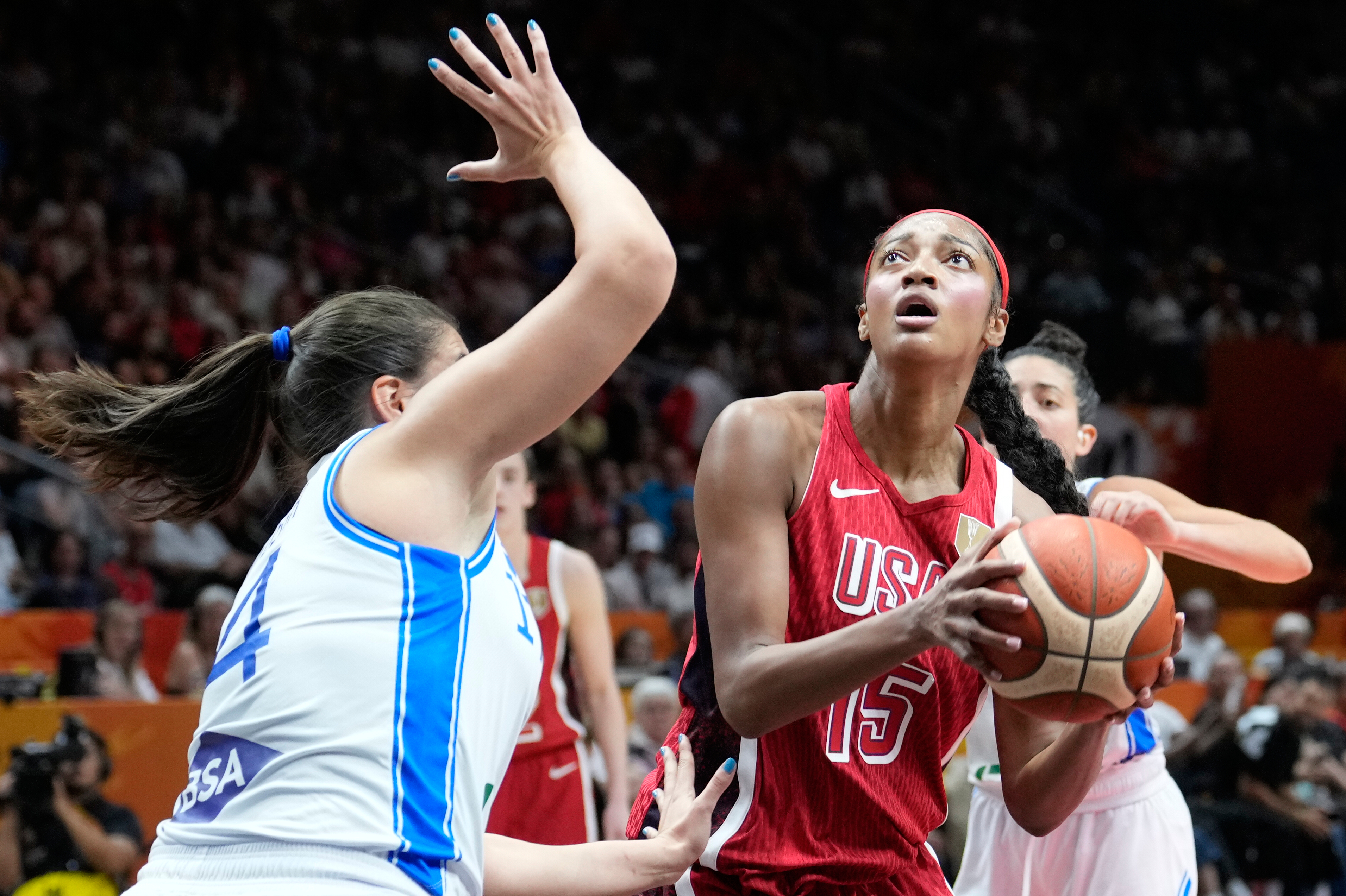 Italy's Sara Madera guards Angel Reese, of the United States, during the Women's Basketball World Cup match between the United States and Italy in Berlin, Sunday, Sept. 6, 2026. 