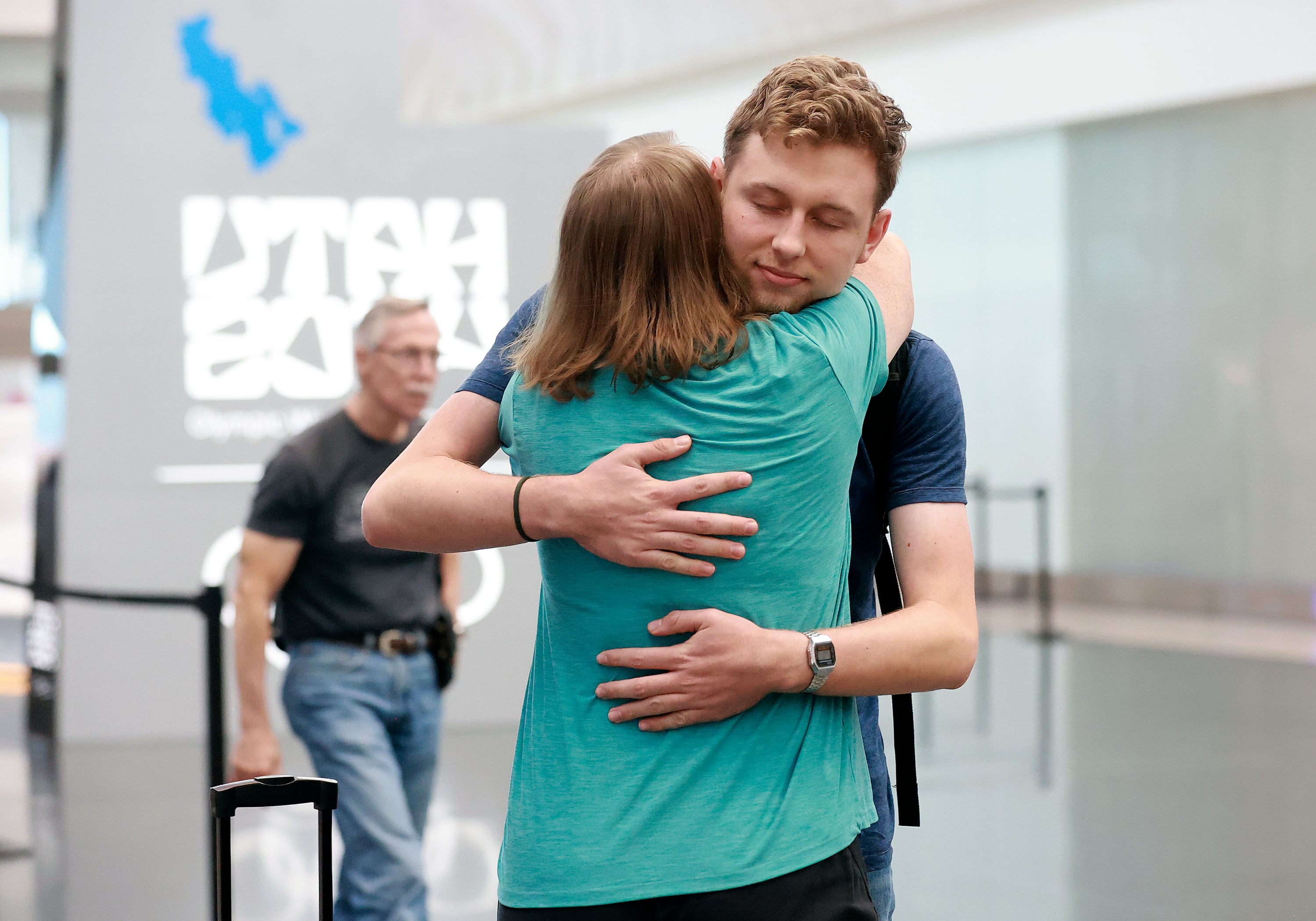 Kristi Johnson hugs her son Tanner Johnson, who has been in Argentina for three weeks, at Salt Lake City International Airport on Wednesday. Kristi Johnson compared waiting for Tanner Johnson to her son coming home from his mission.