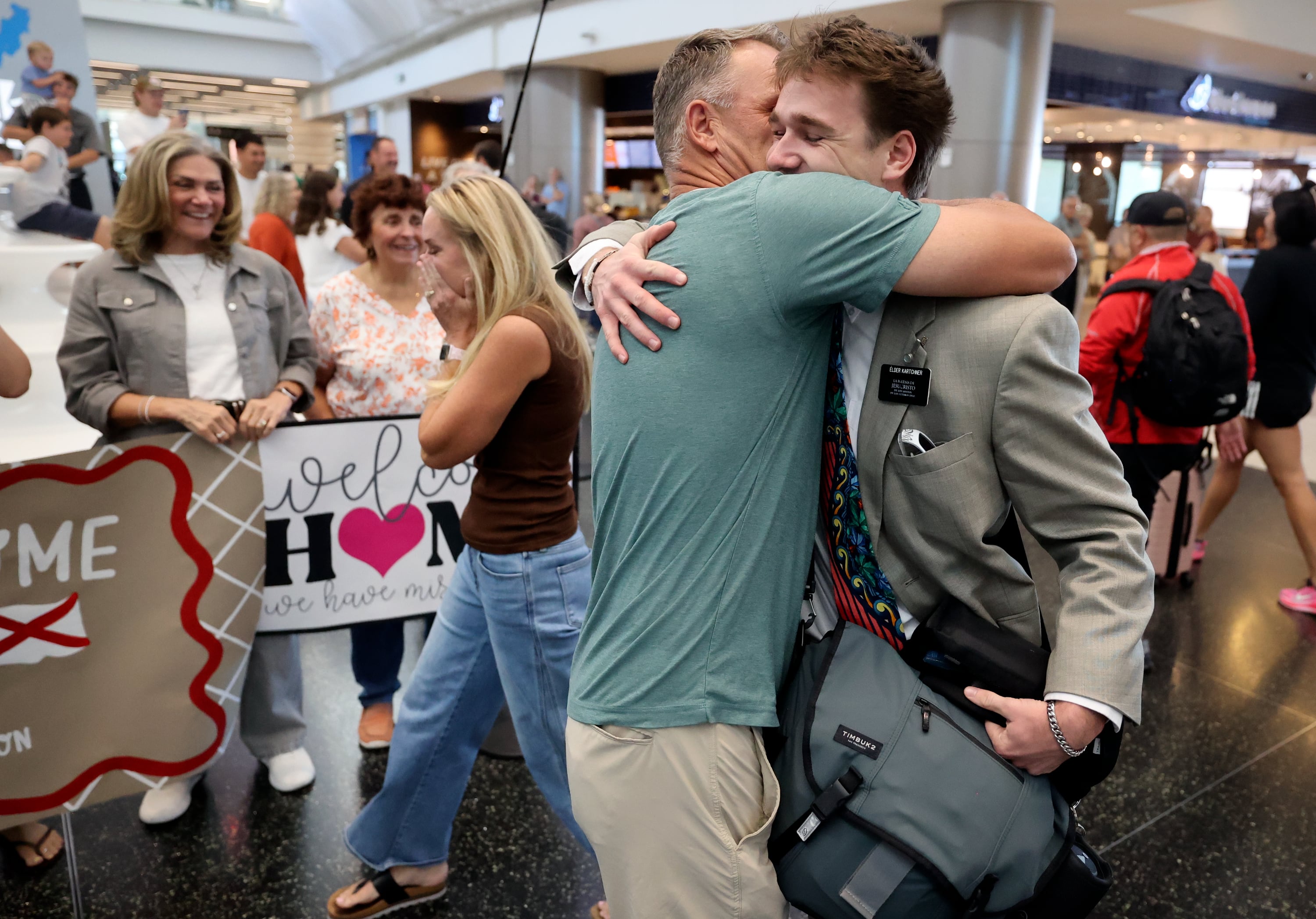 Ryan Kartchner hugs his son, Crew Kartchner, at Salt Lake City International Airport as Crew returns from a mission for The Church of Jesus Christ of Latter-day Saints in Salt Lake City on Wednesday. Some relatives of returning missionaries may not need to wait as long to see them with thanks to a new TSA program.