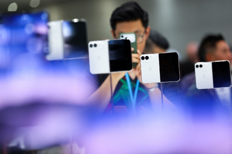 New foldable iPhone Duo devices on display during Apple's event at the Steve Jobs Theater in Cupertino, California, U.S. September 9, 2026.