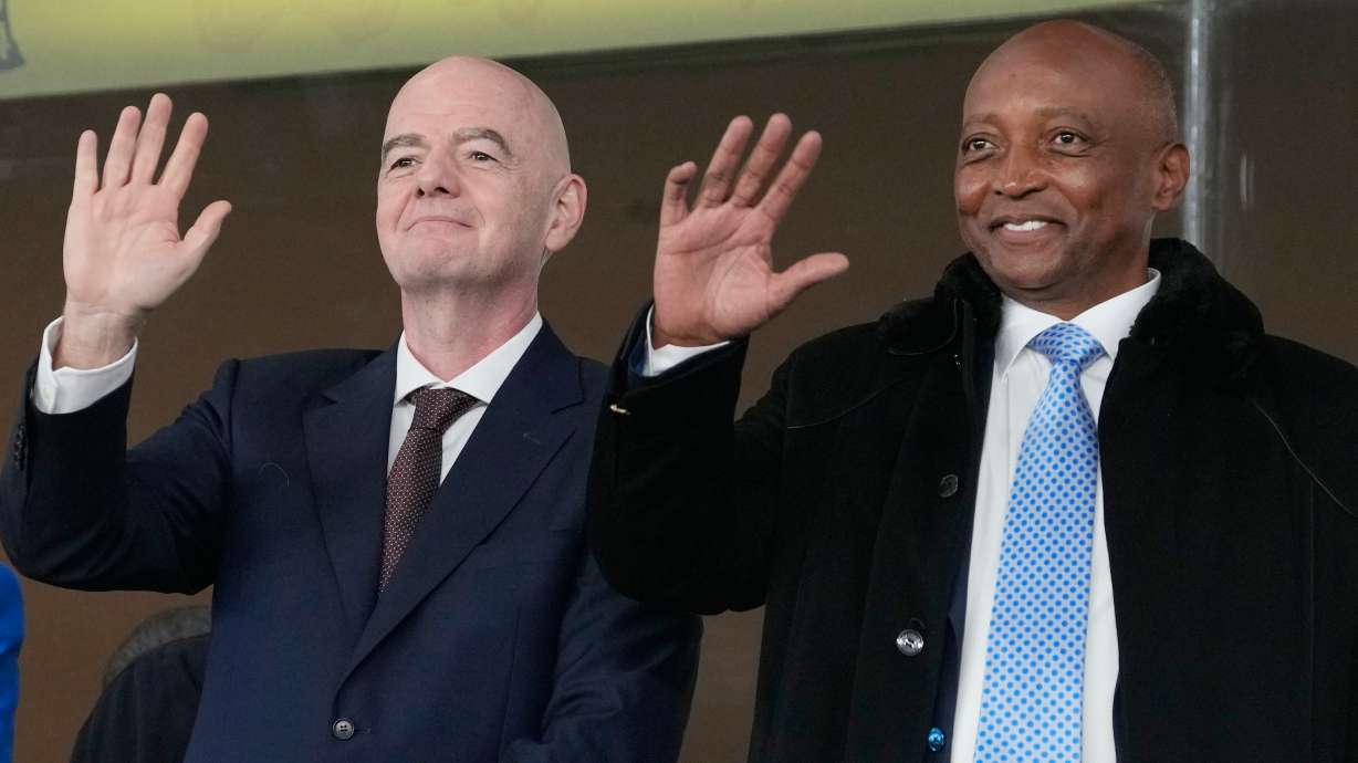 FILE - CAF President Patrice Motsepe and FIFA President Gianni Infantino wave from the tribune during the Africa Cup of Nations round of 16 soccer match between South Africa and Cameroon in Rabat, Morocco, Sunday, Jan. 4, 2026.