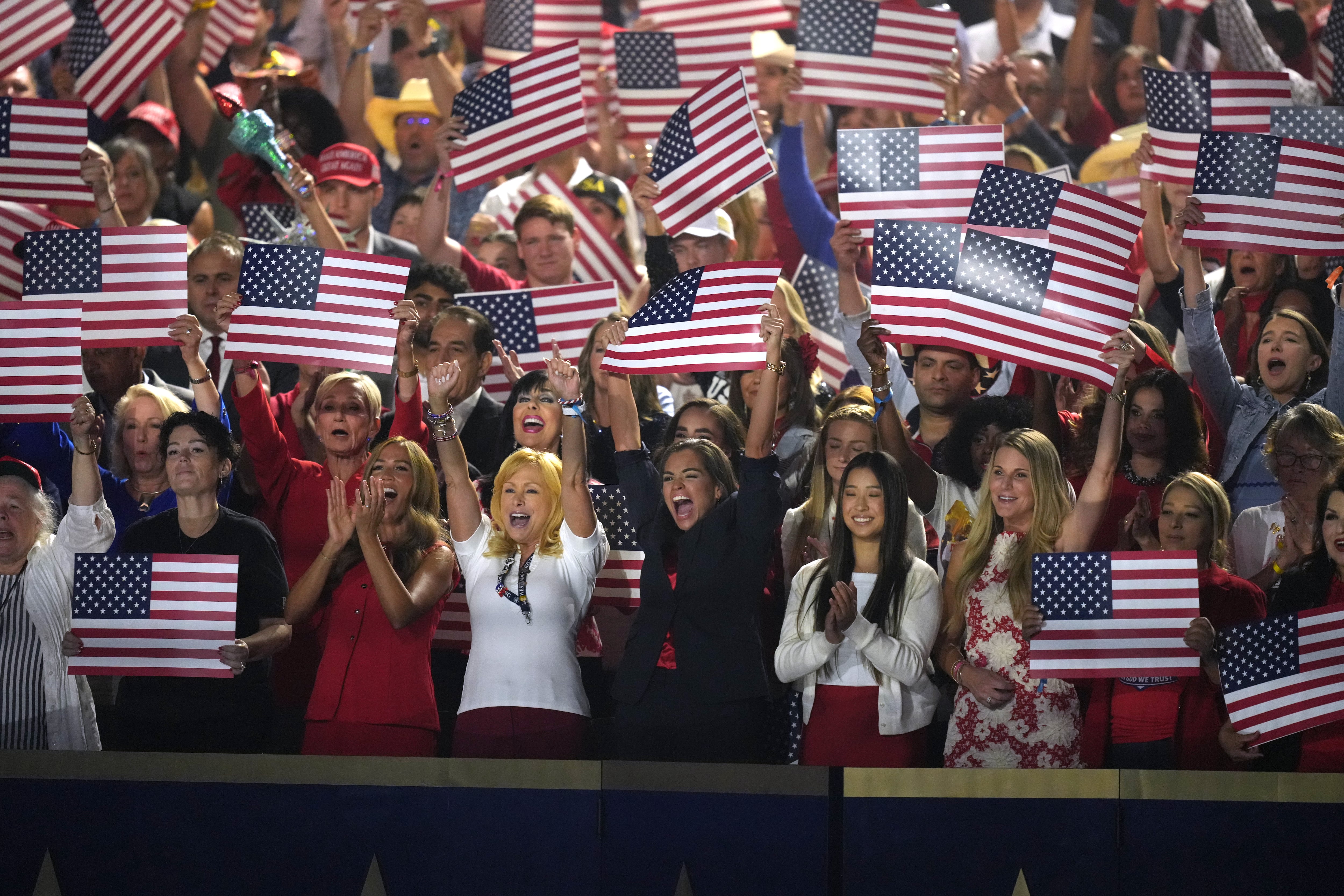 People cheer as Vice President JD Vance speaks at the Republican convention on Thursday in Dallas, Texas.