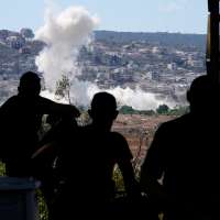 Residents of southern Lebanon gather to watch Israeli drones drop explosives on their village