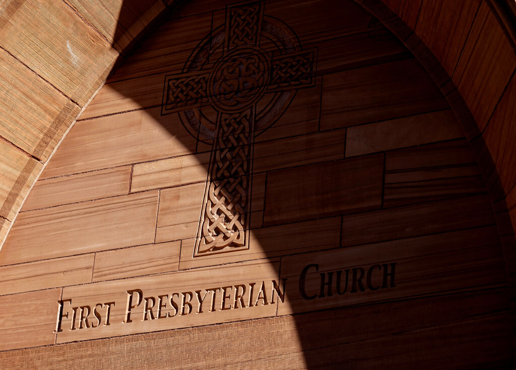 The First Presbyterian Church in Salt Lake City was built out of red sandstone and inscribed with a cross made of Celtic knots to honor its Scottish heritage. Shadows fall across the inscriptions on Wednesday morning.