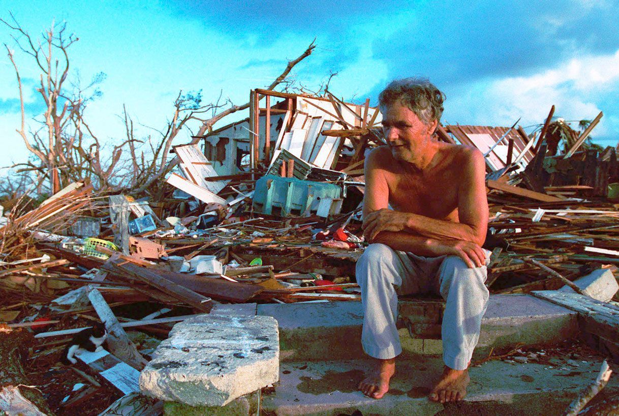 Janny Vancedarfield sits in front of the debris that was once his house in Florida City, Florida, on September 1, 1992, after it was destroyed by Hurricane Andrew.