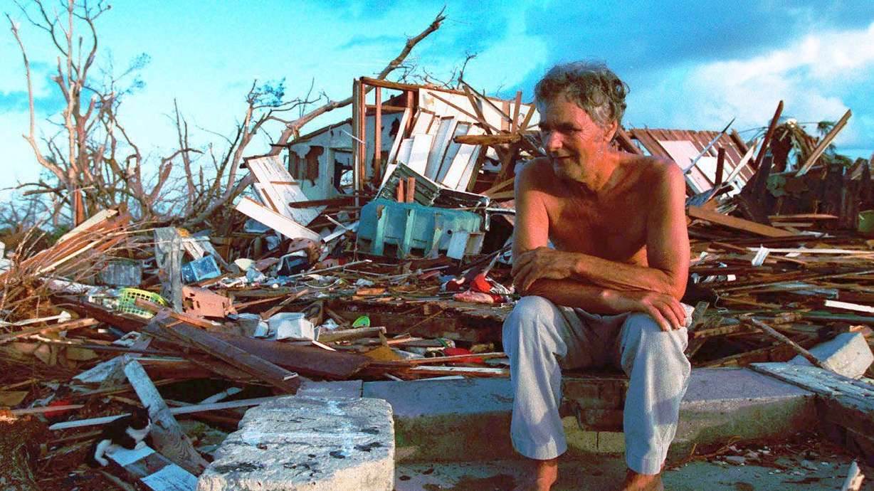 Janny Vancedarfield sits in front of the debris that was once his house in Florida City, Florida, on September 1, 1992, after it was destroyed by Hurricane Andrew.