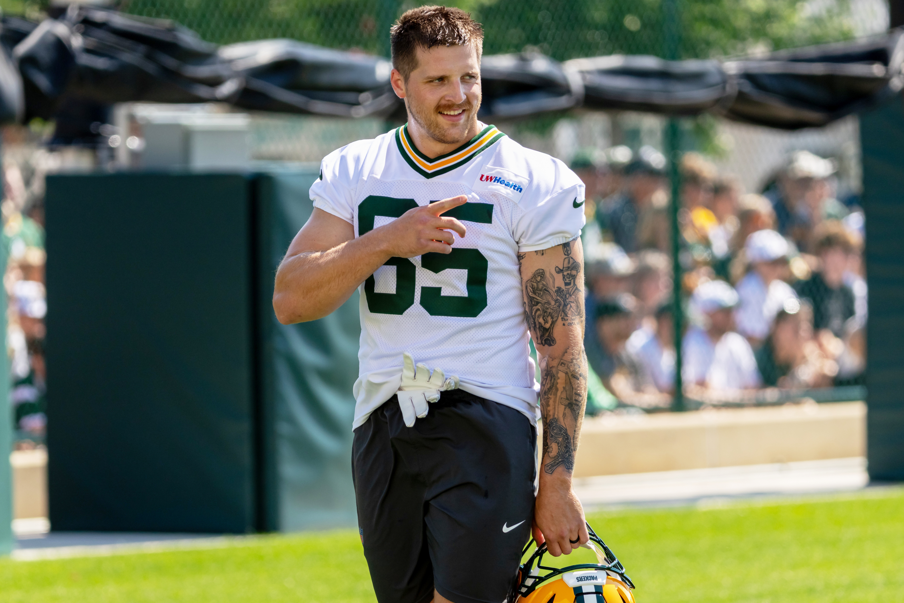 FILE - Green Bay Packers tight end Tucker Kraft points during the NFL football team's training camp, Aug. 2, 2026, in Green Bay, Wis. 