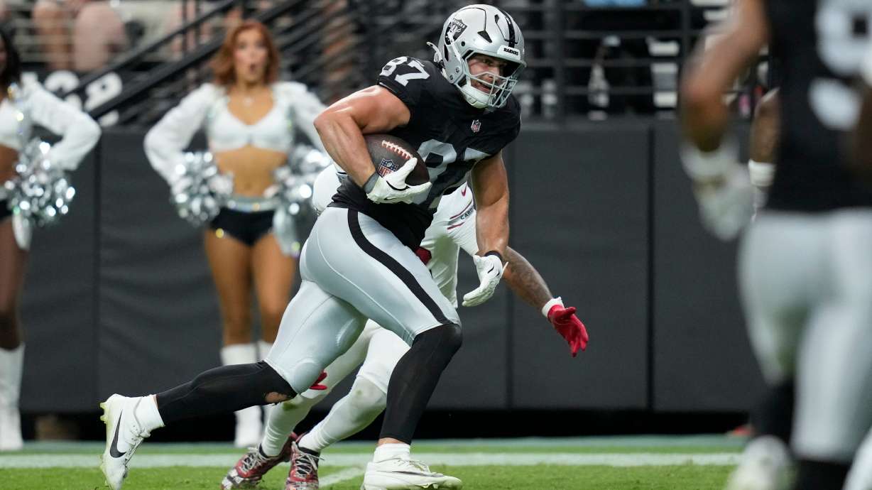 Las Vegas Raiders tight end Michael Mayer breaks away from the Arizona Cardinals defense to score a touchdown during the first half of a preseason NFL football game, Thursday, Aug. 13, 2026, in Las Vegas.