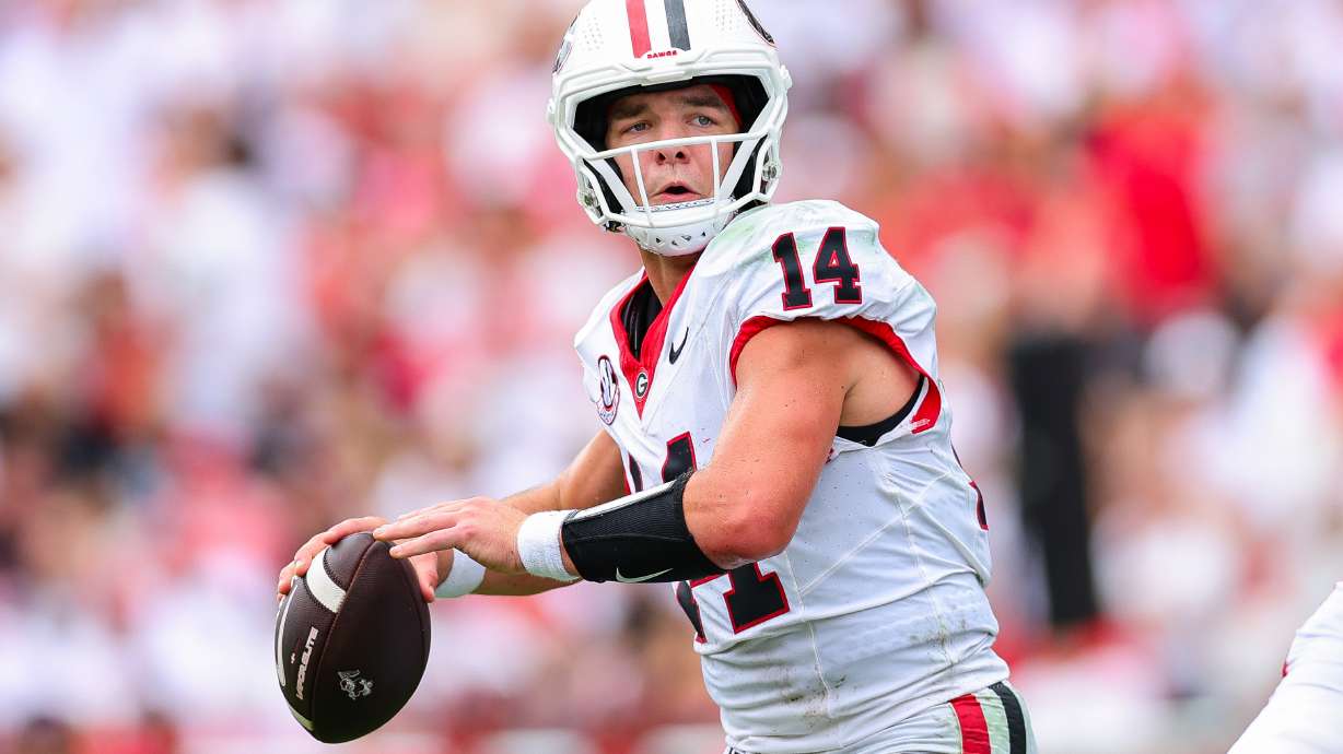 Georgia quarterback Gunner Stockton (14) looks to throw during the first half of an NCAA college football game against Western Kentucky, Saturday, Sept. 12, 2026, in Athens, Ga.