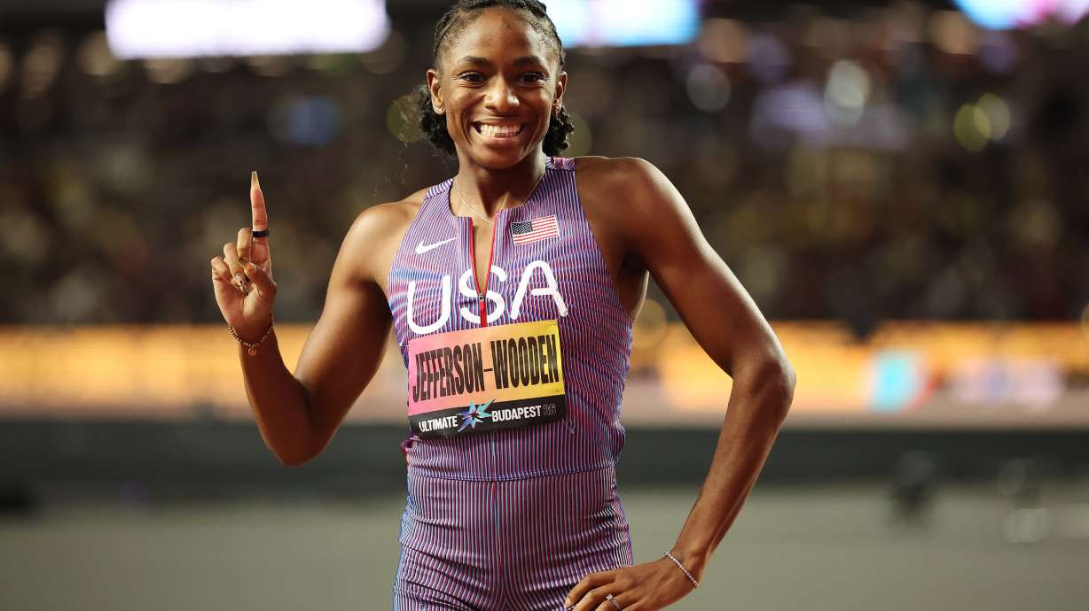 Melissa Jefferson-Wooden, of the United States, celebrates after winning the women's 100 meters final and posting a world-leading time during the World Athletics Ultimate Championship in Budapest, Hungary, Saturday, Sept. 12, 2026.