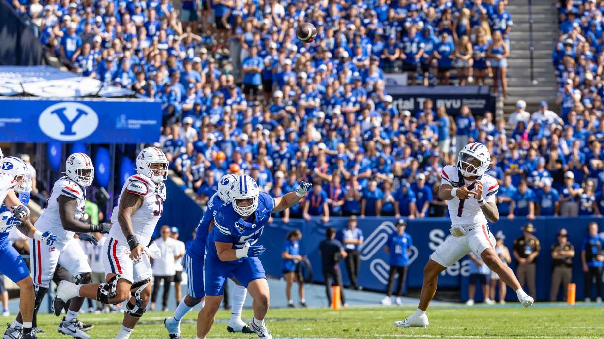 Arizona Wildcats quarterback Noah Fifita (1) makes a leaping pass during a football game against BYU at LaVell Edwards Stadium in Provo on Saturday, Sept. 12, 2026.