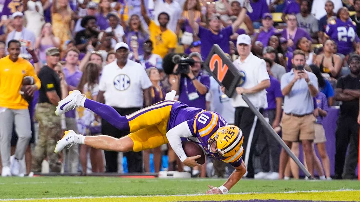 LSU quarterback Sam Leavitt (10) dives into the end zone on a touchdown carry against Louisiana Tech in the first half of an NCAA college football game, Saturday, Sept. 12, 2026 in Baton Rouge, La.