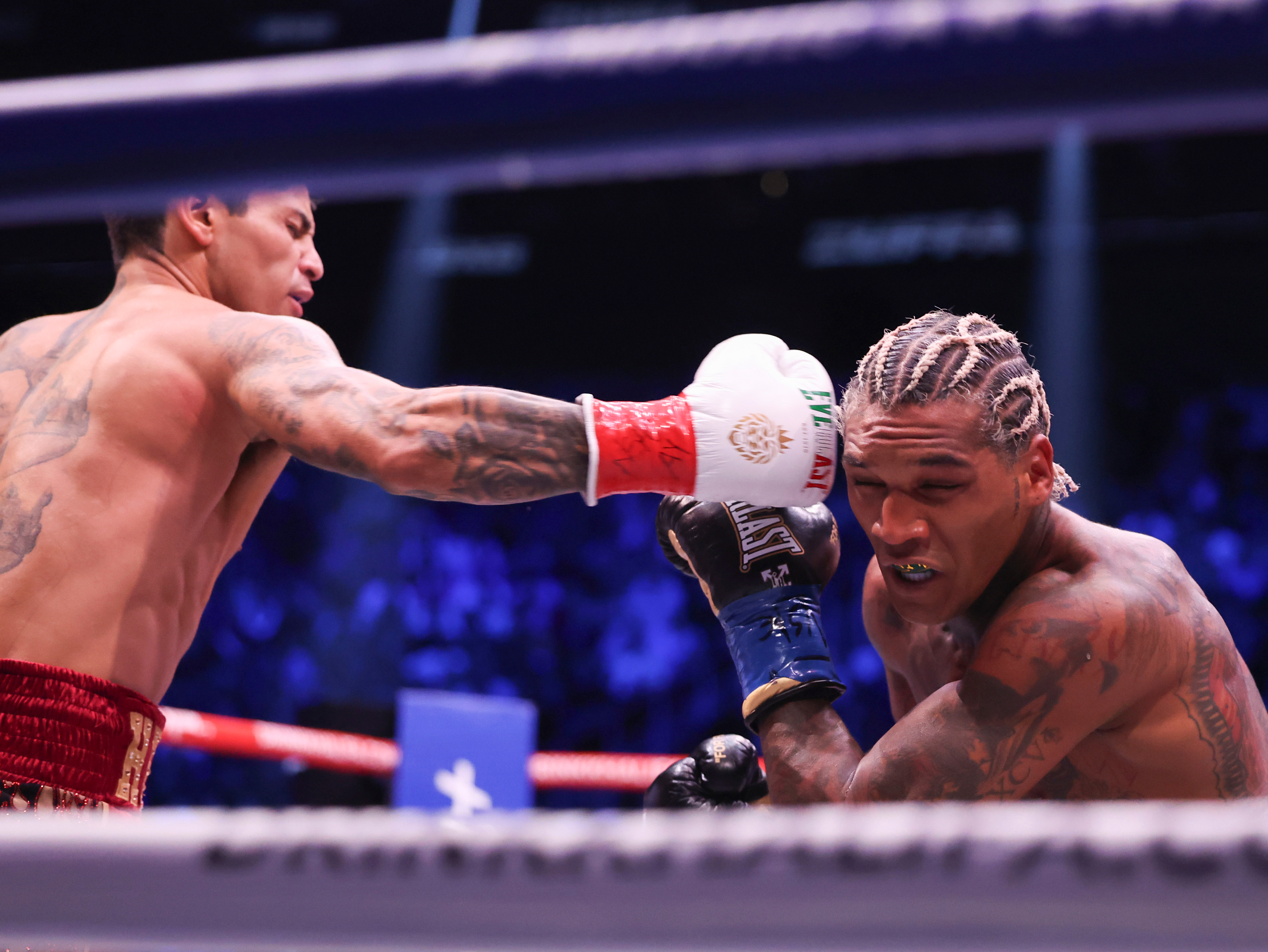 Ryan Garcia, left, punches Conor Benn in their welterweight championship fight Saturday, Sept. 12, 2026, in Las Vegas. 