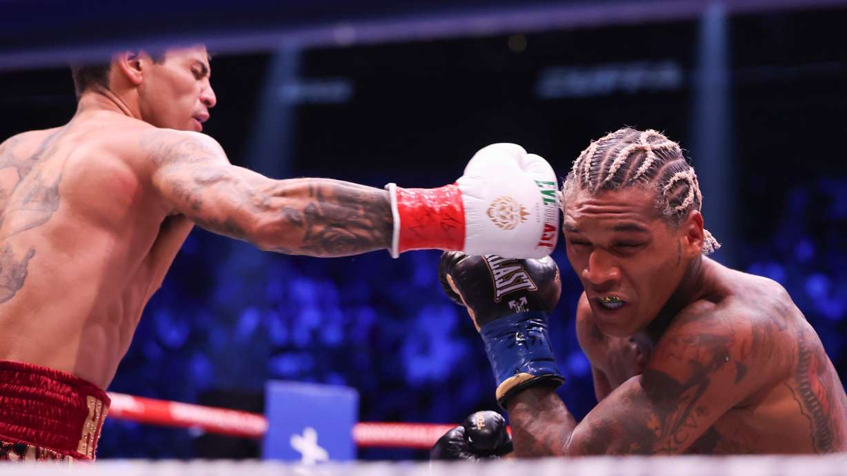 Ryan Garcia, left, punches Conor Benn in their welterweight championship fight Saturday, Sept. 12, 2026, in Las Vegas.