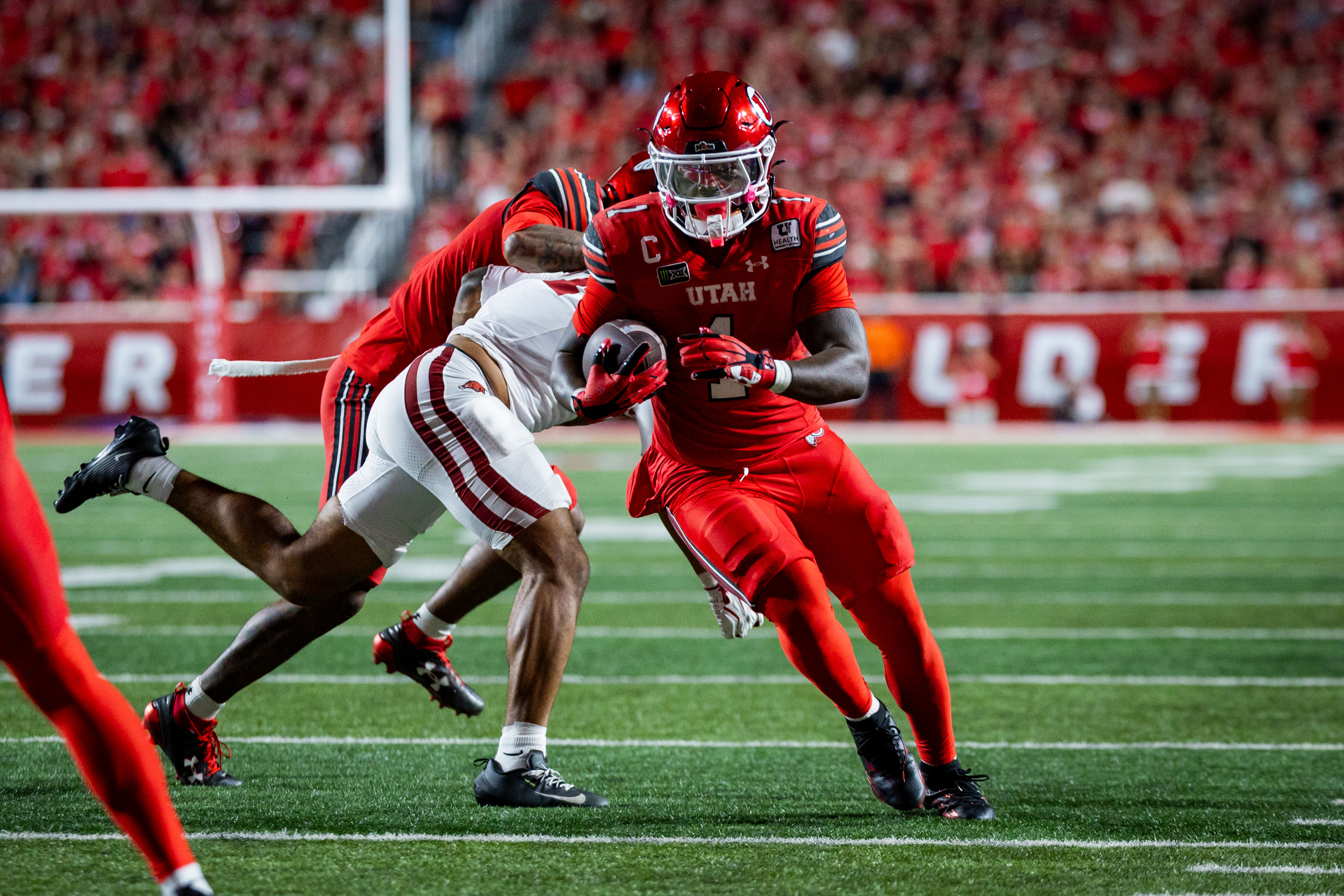 Utah Utes running back Wayshawn Parker (1) runs down the field during a football game against the Arkansas Razorbacks at Rice-Eccles Stadium in Salt Lake City on Saturday, Sept. 13, 2026.