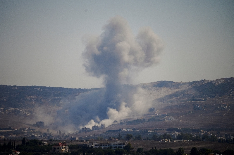 Smoke rises in southern Lebanon following an Israeli strike, as seen from Zawtar al-Gharbiyeh, southern Lebanon, on Sunday.