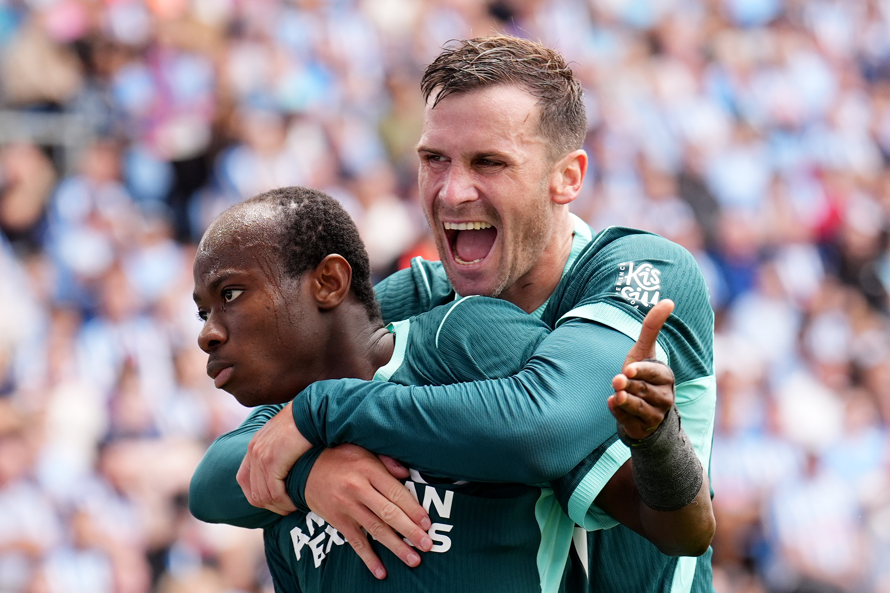 Brighton and Hove Albion's Malick Yalcouye, left, celebrates with Pascal Gross after scoring their side's second goal of the game during the English Premier League soccer match between Coventry City and Brighton and Hove Albion in Coventry, England, Sunday Sept. 13, 2026. 