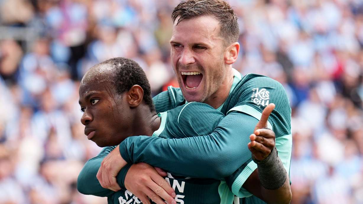 Brighton and Hove Albion's Malick Yalcouye, left, celebrates with Pascal Gross after scoring their side's second goal of the game during the English Premier League soccer match between Coventry City and Brighton and Hove Albion in Coventry, England, Sunday Sept. 13, 2026.