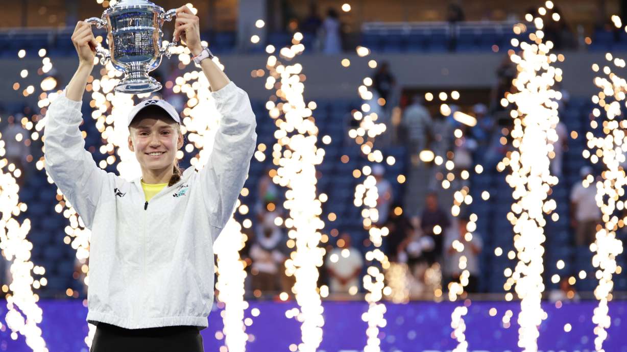 Elena Rybakina, of Kazakhstan, holds up her trophy after winning the women's singles final of the U.S. Open tennis championships against Aryna Sabalenka, of Belarus, Saturday, Sept. 12, 2026, in New York.
