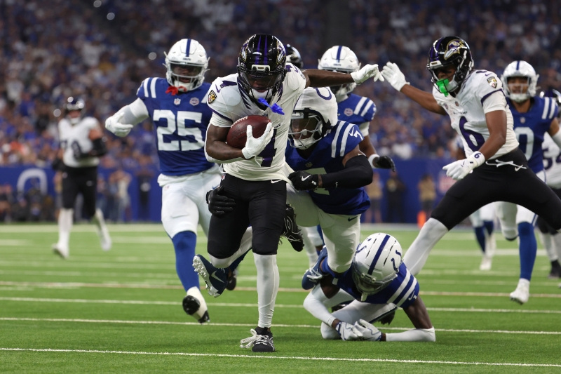 Sep 13, 2026; Indianapolis, Indiana, USA;  Baltimore Ravens wide receiver Zay Flowers (4) runs with the ball for a touchdown against the Indianapolis Colts at Lucas Oil Stadium.