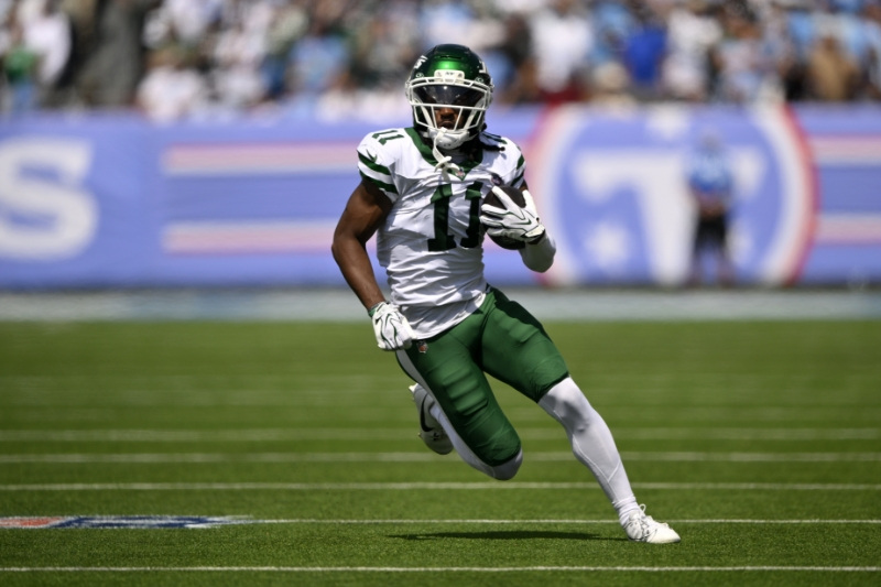 Sep 13, 2026; Nashville, Tennessee, USA;  New York Jets wide receiver Omar Cooper J.r (11) runs with the ball against the Tennessee Titans during the first quarter at Nissan Stadium.