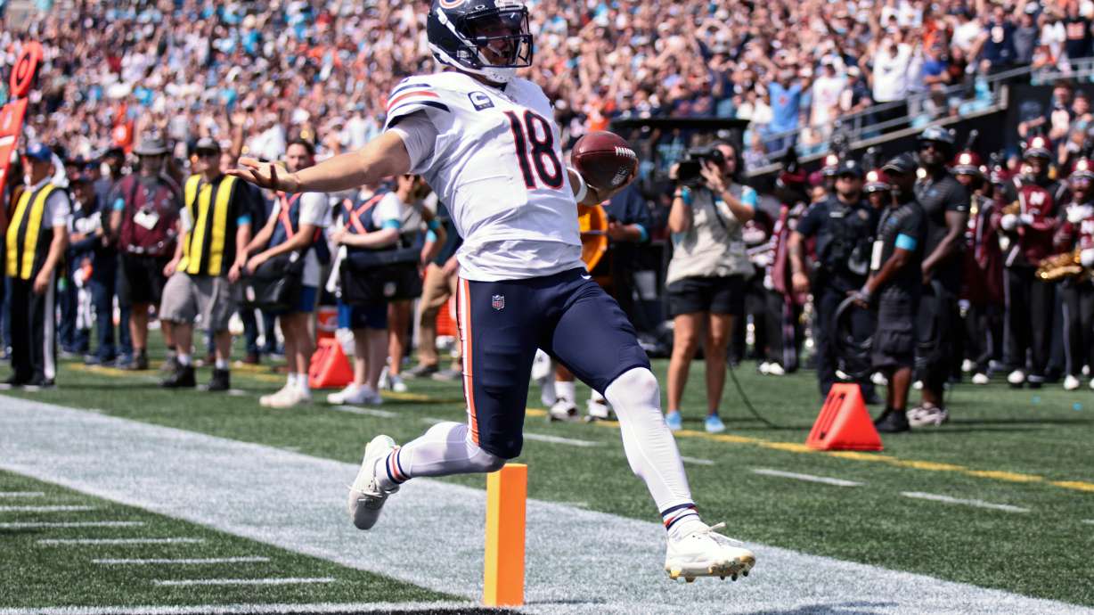 Chicago Bears quarterback Caleb Williams (18) runs to score a touchdown during the first half of an NFL football game, Sunday, Sept. 13, 2026, in Charlotte, N.C.