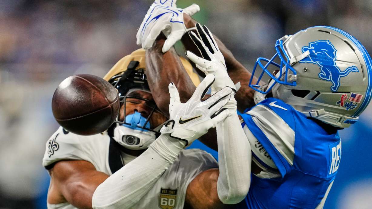 Detroit Lions cornerback D.J. Reed (4) breaks up a pass intended for New Orleans Saints wide receiver Chris Olave (12) in the first half of an NFL football game, Sunday, Sept. 13, 2026, in Detroit.