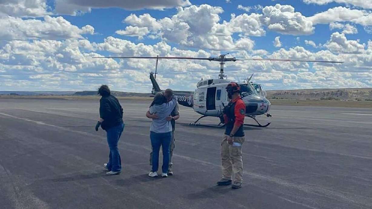 Jonathan Bailey is greeted with a hug at the airport in Pinedale, Wyo., on Friday after being rescued after wandering for a week in the Wind River Range. A missing Idaho Falls man who went hiking in the Wyoming mountains with his dog has been found.