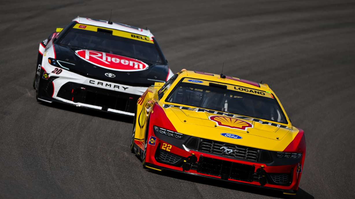 Christopher Bell (20) and Joey Logano (22) compete during a NASCAR Cup Series auto race Sunday, Sept. 13, 2026, in Madison, Ill.