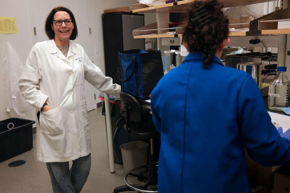 Donna Cross, University of Utah Neuroimaging and Biotechnology Laboratory director and research associate professor, talks with Jenna Aguilar Medina, radiology research lab tech, while setting up an experiment in the Sorenson Molecular Biotech Building at the University of Utah in Salt Lake City on Aug. 19. The experiment was postponed due to a shipment delay of radioactive material required for the experiment.