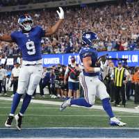Giants' offense rolls over the Cowboys to give coach John Harbaugh a 28-20 win in his debut