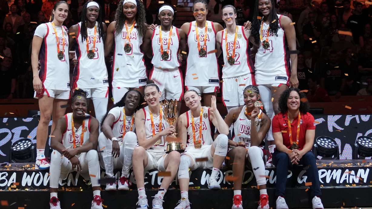 United States plyers pose on the podium after winning the Women's Basketball World Cup final match between the United States and France in Berlin, Sunday, Sept. 13, 2026.