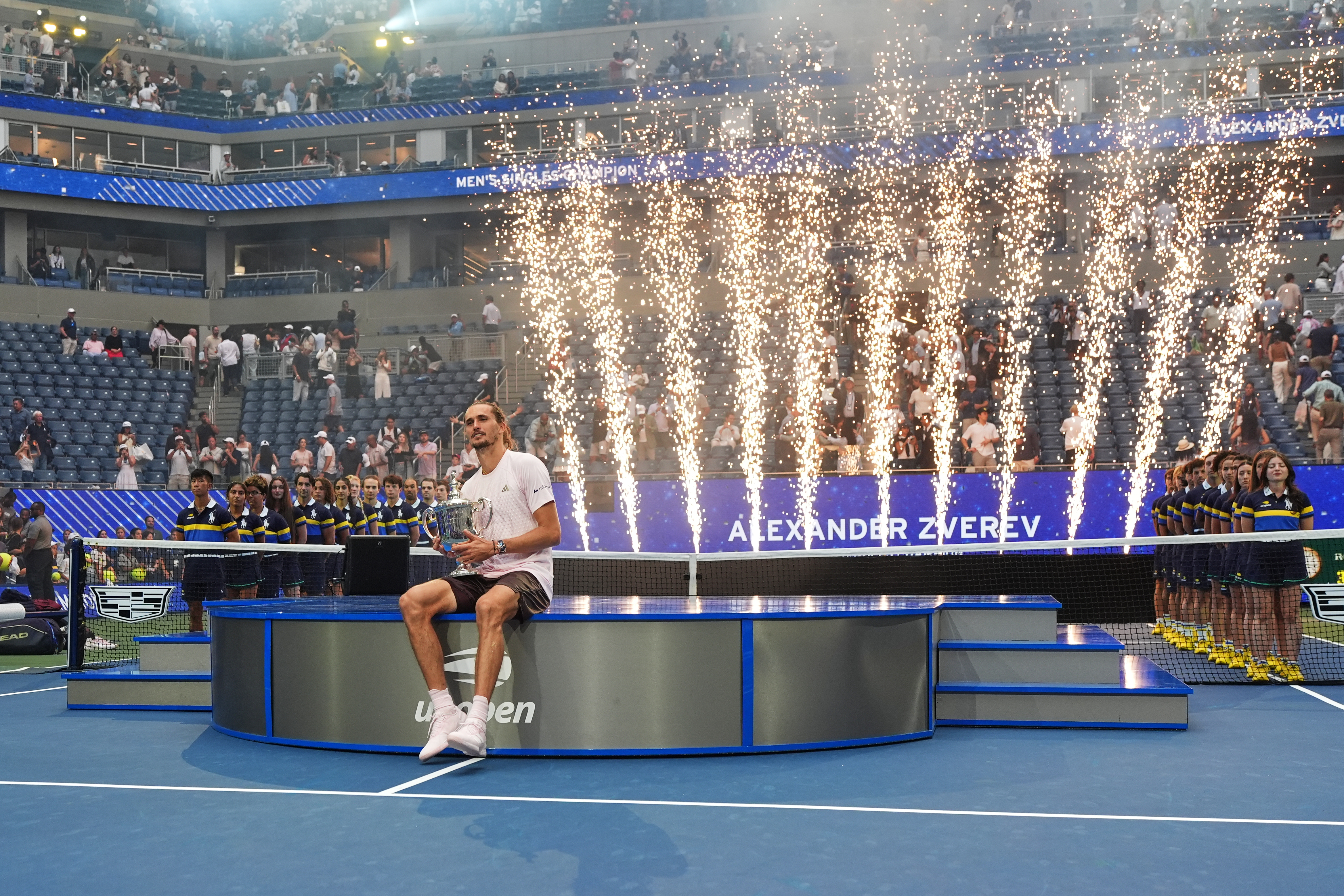 Alexander Zverev, of Germany, holds his trophy after winning the men's singles final of the U.S. Open tennis championships against Ben Shelton, of the United States, Sunday, Sept. 13, 2026, in New York. 