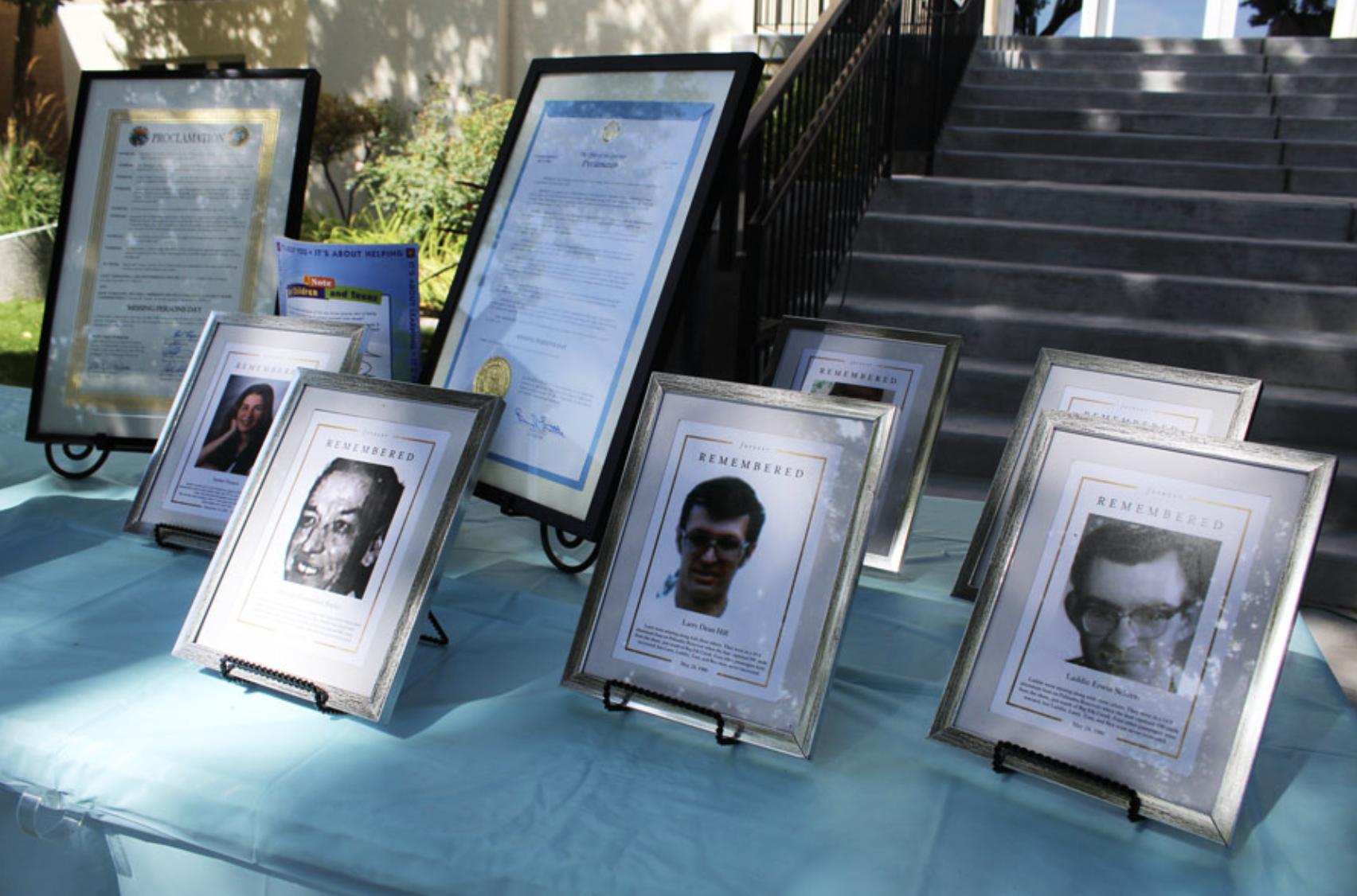 Framed photos and details of some of the missing people in Idaho.