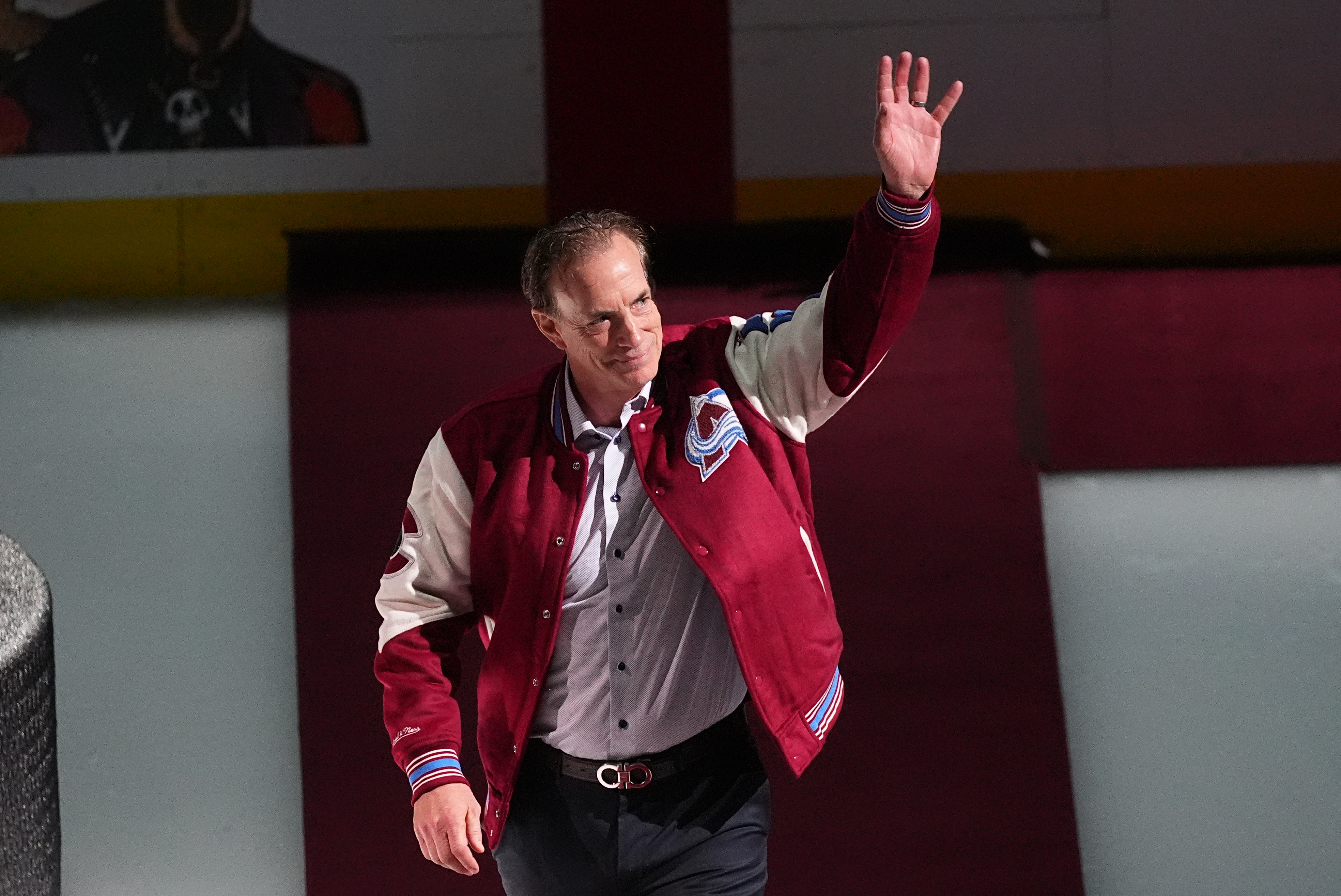 FILE - Joe Sakic, current general manager of the Colorado Avalanche as well as a member of the 1996 Stanley Cup Championship team, waves as he is introduced during a ceremony to mark the 30th anniversary of the win before an NHL hockey game against the Florida Panthers, on Dec. 11, 2025, in Denver. 