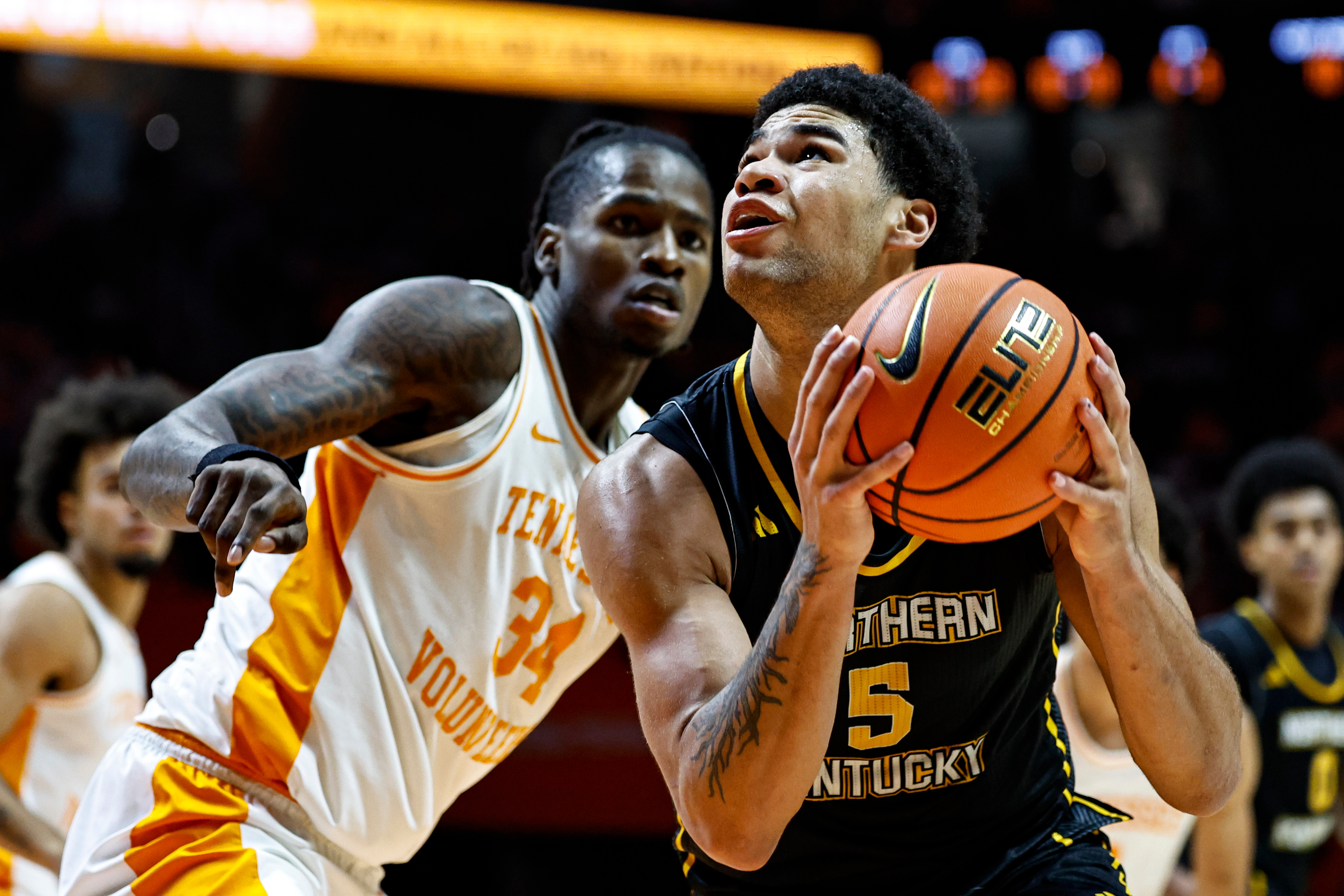 FILE - Northern Kentucky forward LJ Wells (5) goes for a shot as he's defended by Tennessee center Felix Okpara (34) during the second half of an NCAA college basketball game Nov. 8, 2025, in Knoxville, Tenn. 