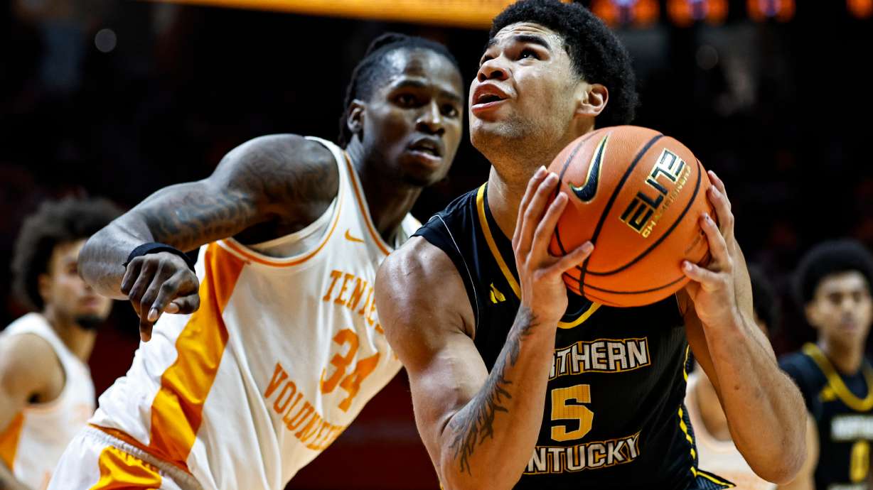 FILE - Northern Kentucky forward LJ Wells (5) goes for a shot as he's defended by Tennessee center Felix Okpara (34) during the second half of an NCAA college basketball game Nov. 8, 2025, in Knoxville, Tenn.