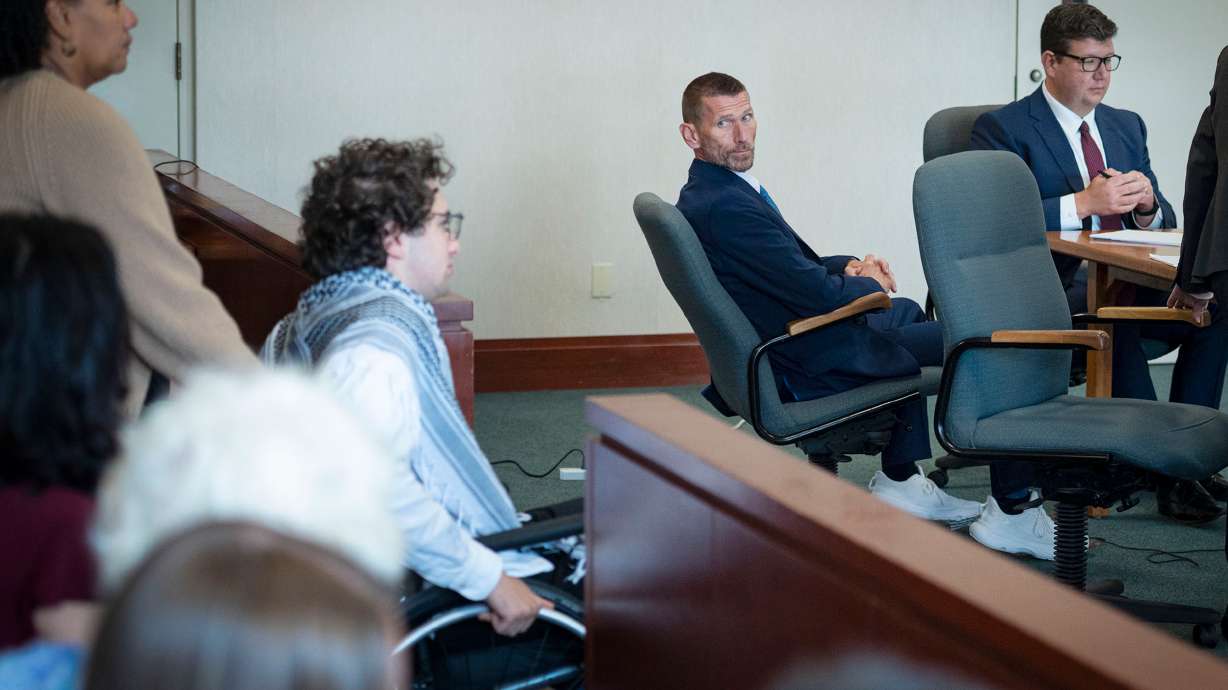 Jason Eaton watches as Hisham Awartani arrives to testify in Eaton's trial in Burlington, Vt., on Monday. Jason Eaton insisted he was acting on orders from the CIA and Mossad when he shot three Palestinian college students who were walking past his home a few days after Thanksgiving.