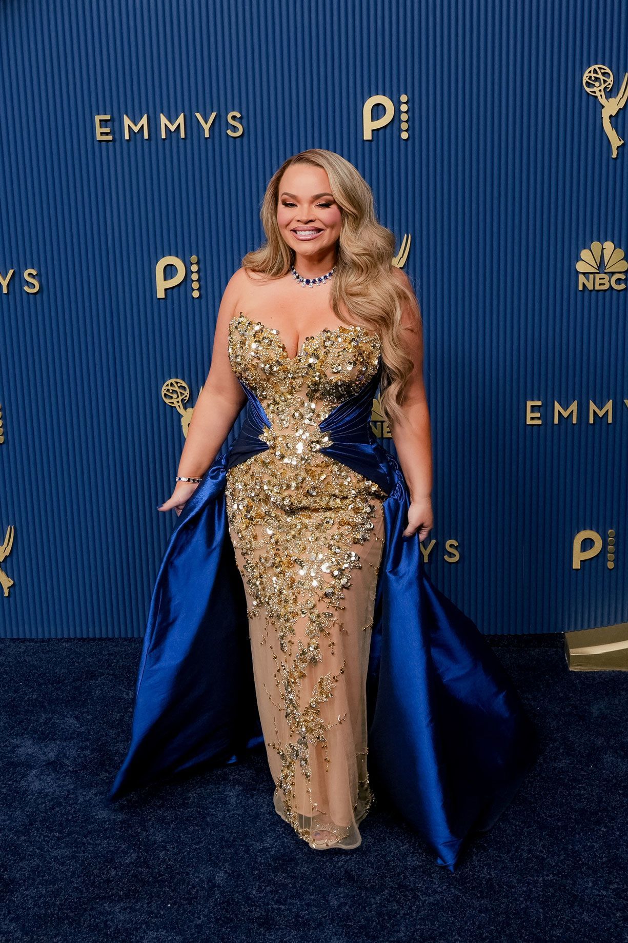 Influencer Trisha Paytas, who is co-hosting the Emmys red carpet livestream, mixed shimmering gems and blue velvet.