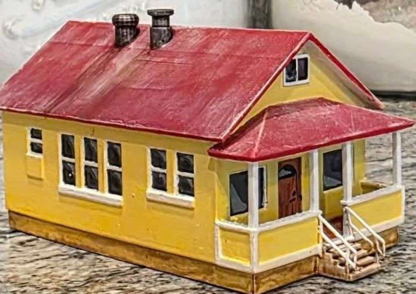 The finished miniature replica of the home, created by Jonah Saunders using photographs of the original house as a reference.