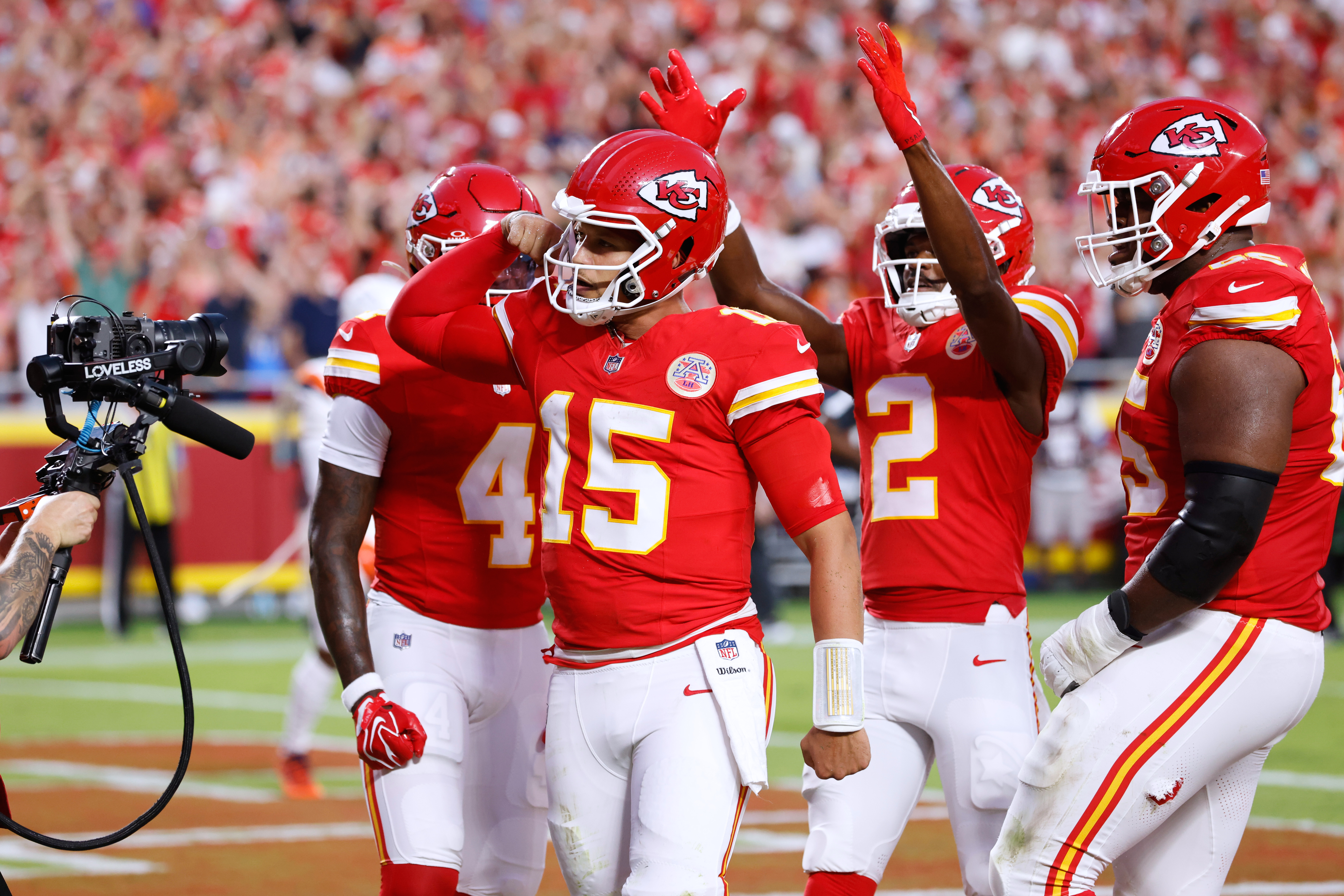 Kansas City Chiefs quarterback Patrick Mahomes (15) celebrates his touchdown run with teammates wide receiver Rashee Rice (4), wide receiver Tyquan Thornton (2) and guard Trey Smith (65) during the first half of an NFL football game against the Denver Broncos, Monday, Sept. 14, 2026, in Kansas City, Mo. 