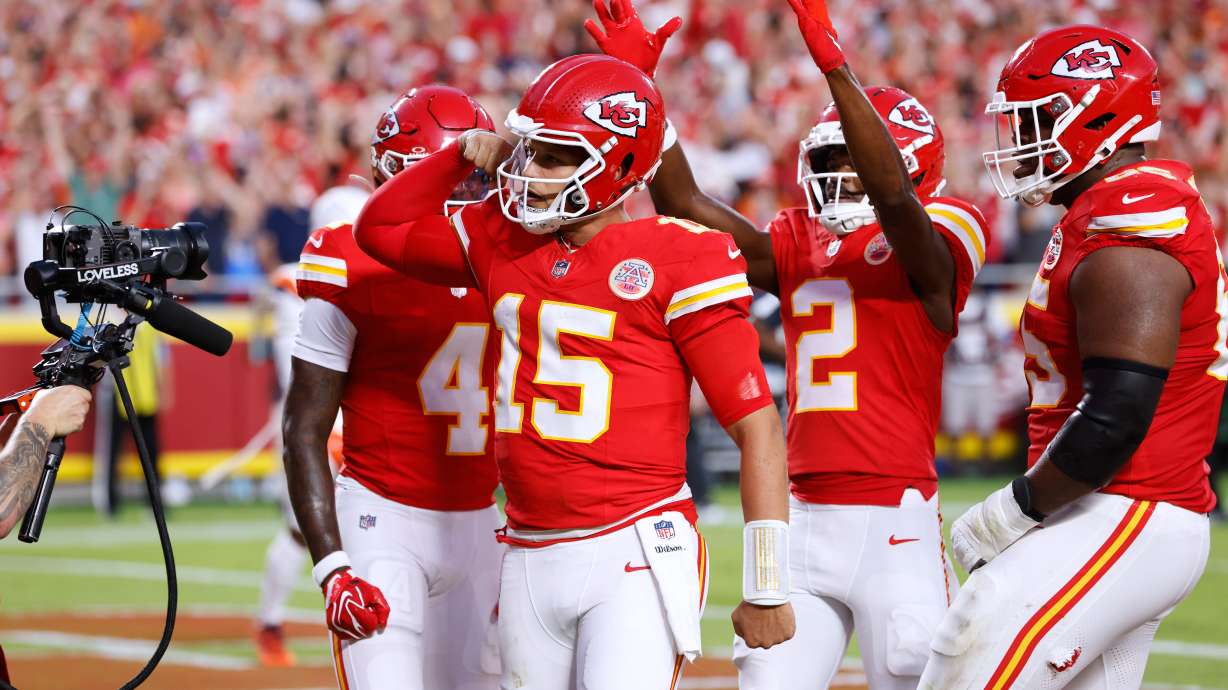 Kansas City Chiefs quarterback Patrick Mahomes (15) celebrates his touchdown run with teammates wide receiver Rashee Rice (4), wide receiver Tyquan Thornton (2) and guard Trey Smith (65) during the first half of an NFL football game against the Denver Broncos, Monday, Sept. 14, 2026, in Kansas City, Mo.