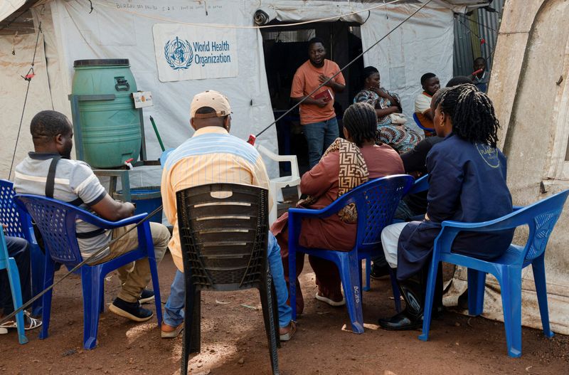 Members of a civil protection team tasked with safely burying people suspected of having died from Ebola attend a daily briefing before deploying to the field to handle bodies, collect samples and disinfect the remains of people suspected of having died from Ebola, in Butembo, North Kivu province, Democratic Republic of Congo, September 13, 2026.